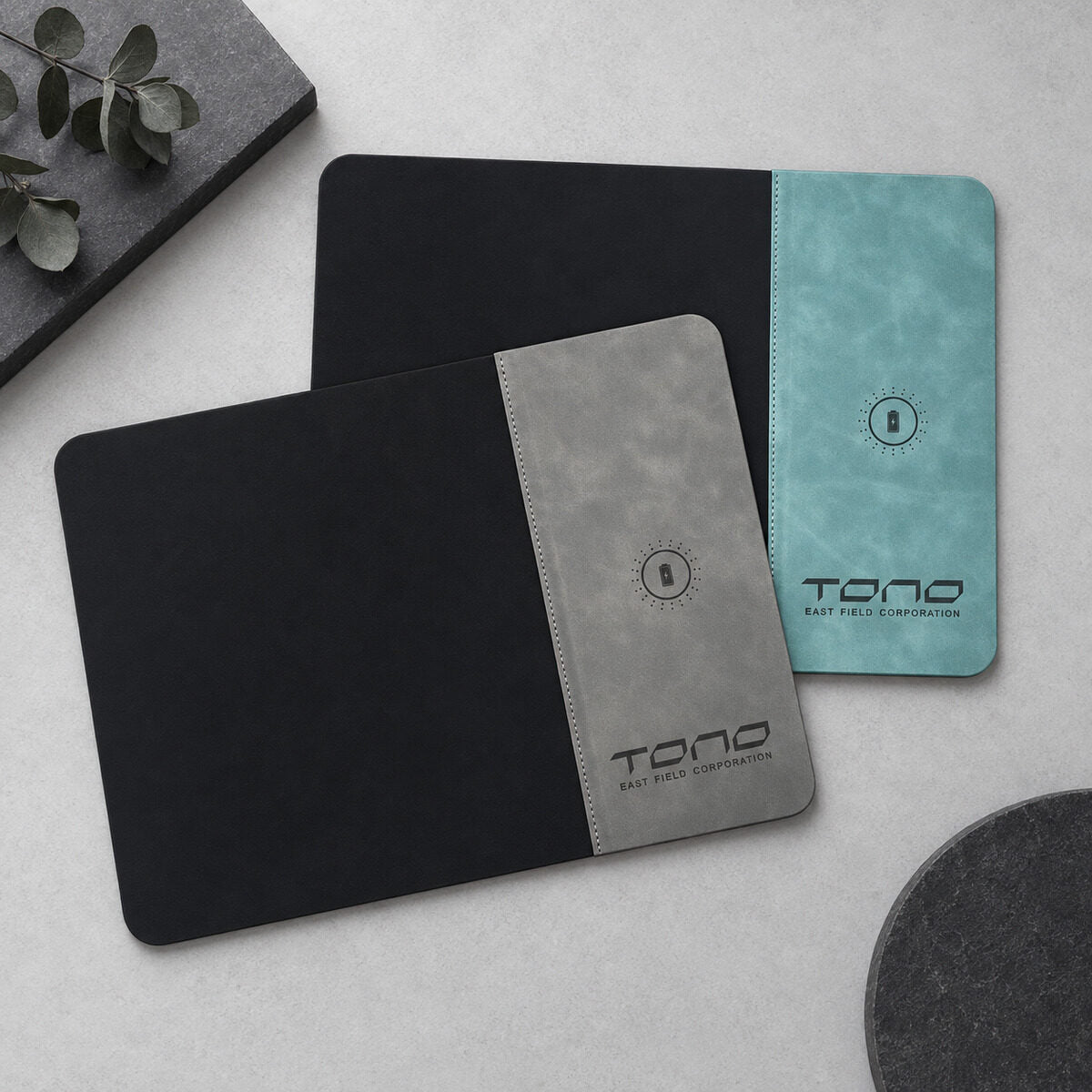 Debossed logo on a leather desk pad