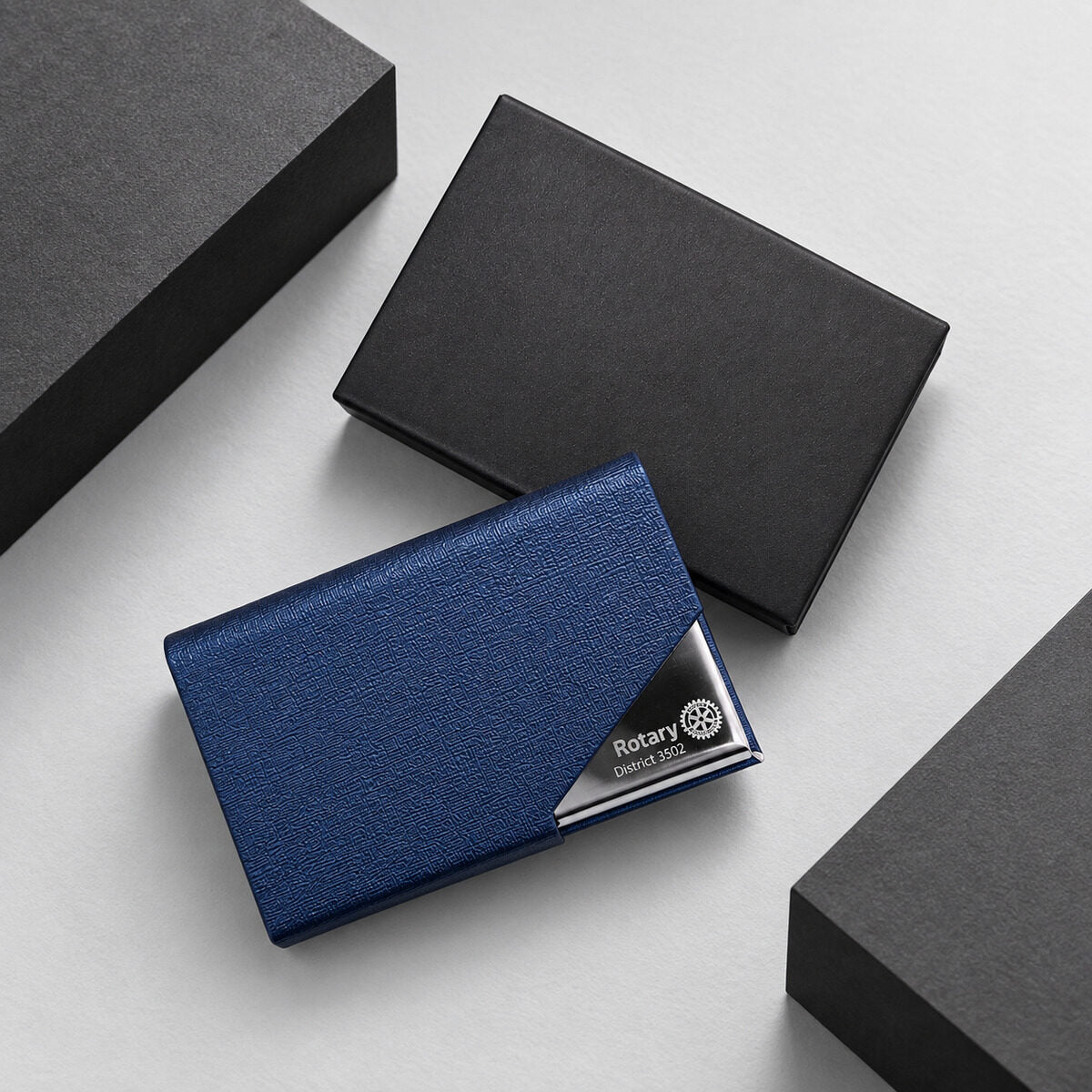 Engraved emblem on a leather card holder