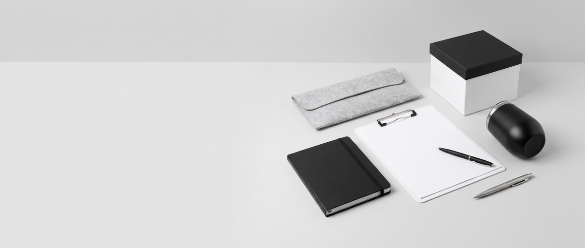Corporate gifts arranged on a desk beside a quote sheet